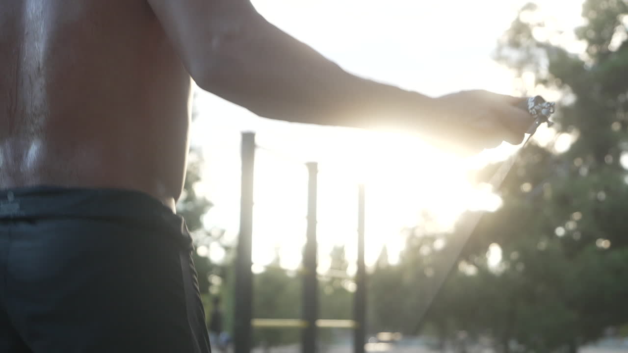 Man Jumping Rope in Park