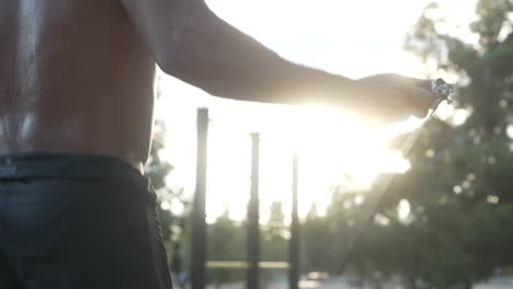 man jumping rope in park