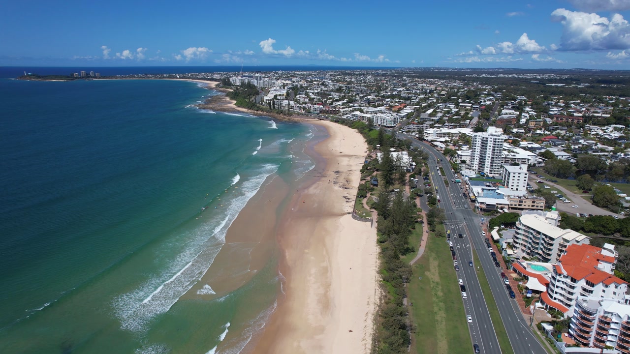 Alexandra Headland Coastal Suburb With Beach, Highways And Park In Summer In Queensland, Australia. - aerial shot