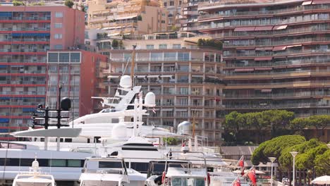 yacht docked with scenic monte carlo backdrop