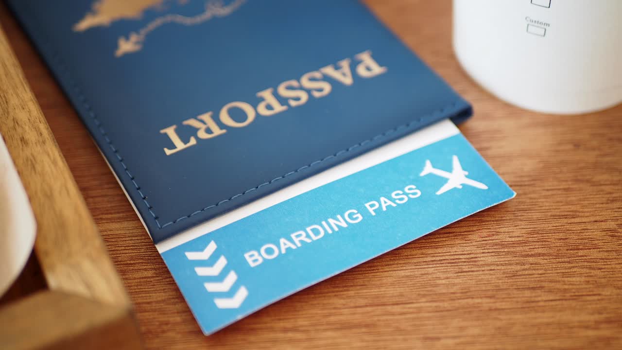 Passport and Boarding Pass on Table