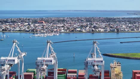 shipping cranes operate at melbourne webb dock east to load containers