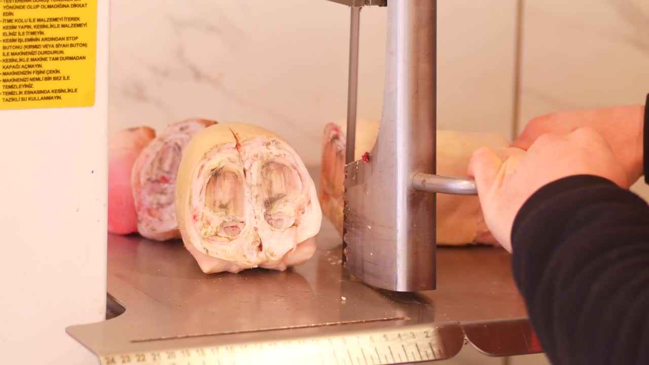 Slicing Pork Feet at a Butcher Shop