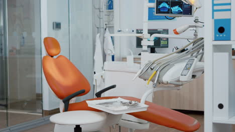 revealing shot of stomatologist chair with nobody in