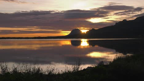 Sunrise-reflection-on-Calm-Lake-at-dawn