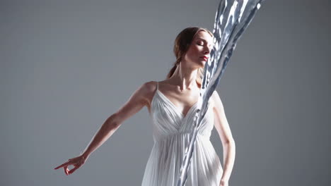 woman in white dress with flowing water