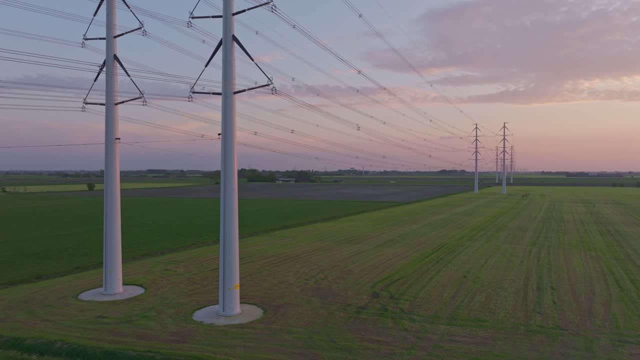 Westerwijtwerd countryside with powerlines at sunset,Netherlands