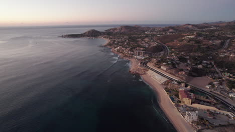 coastal line with highway of los cabos, mexico filled with resorts and hotels