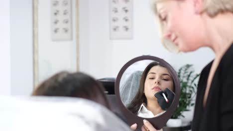permanent lip makeup procedure for women an experienced beautician applies pigment makeup to the permanent lip makeup procedure for women an experienced beautician applies pigment makeup to the lips using a tattoo machine