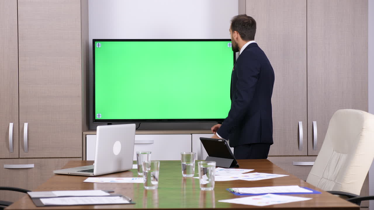 Business Meeting with Green Screen Display