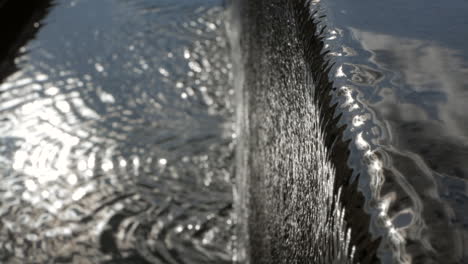 beautiful waterfall effect at the edge of a pool -close up