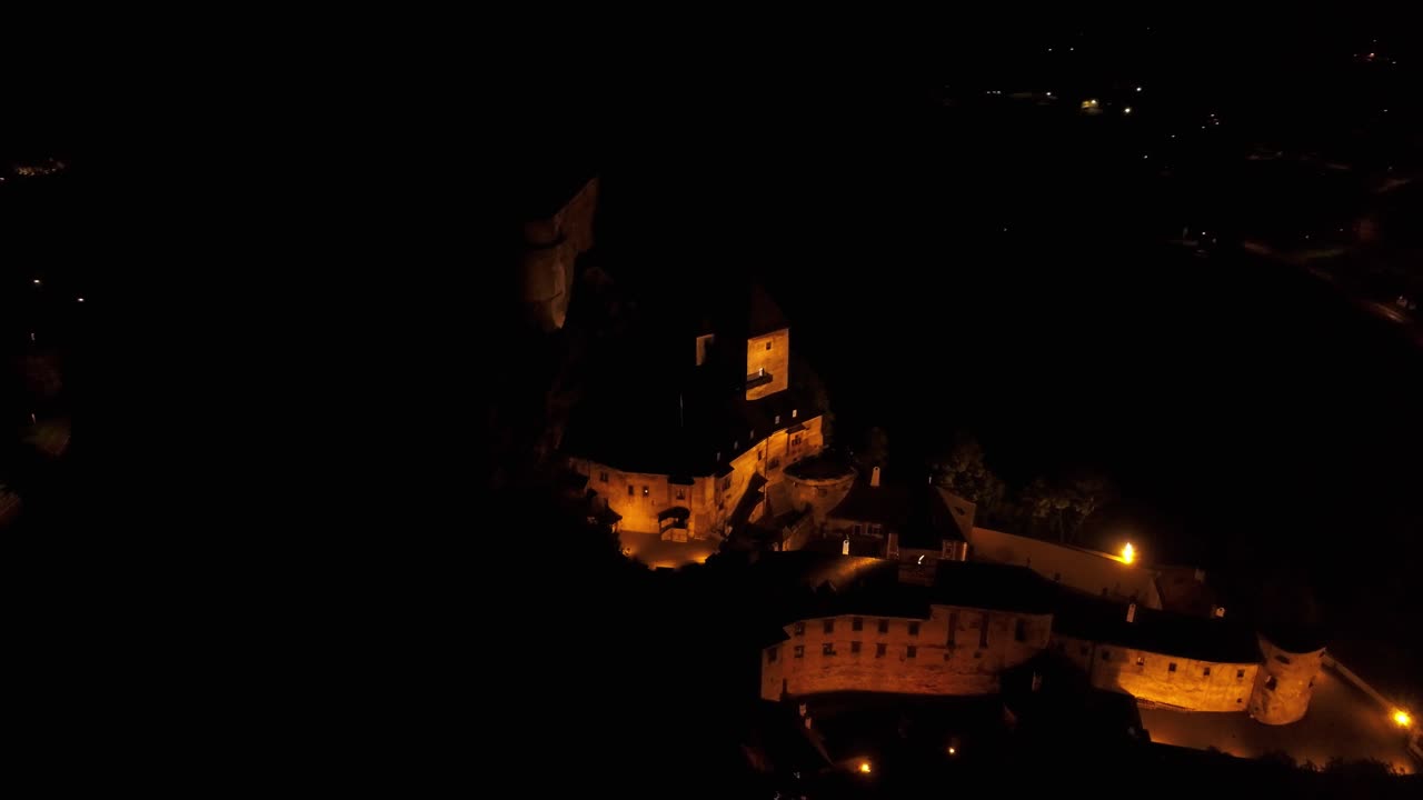 Aerial View of an Illuminated Castle at Night