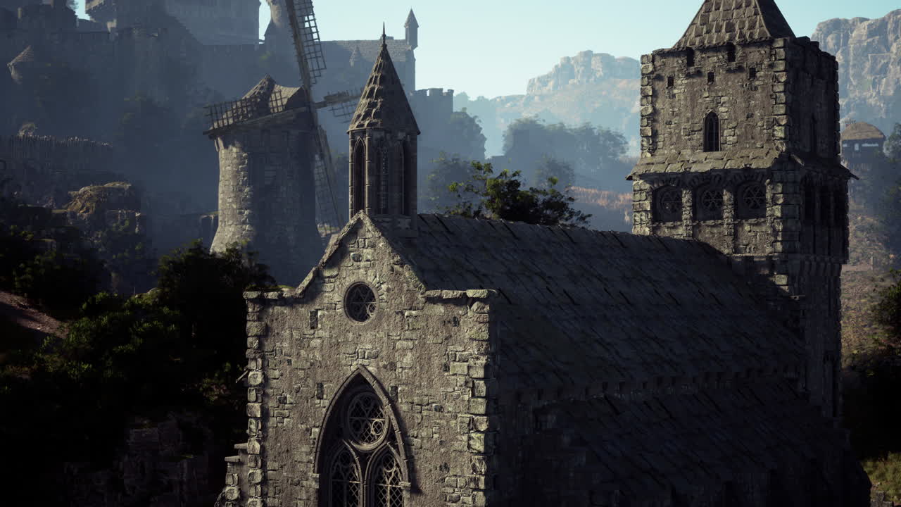pueblo medieval con iglesia y molino de viento