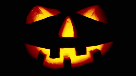 scary old jack-o-lantern on black background.