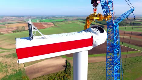 construction of new wind turbine in green field - aerial close up