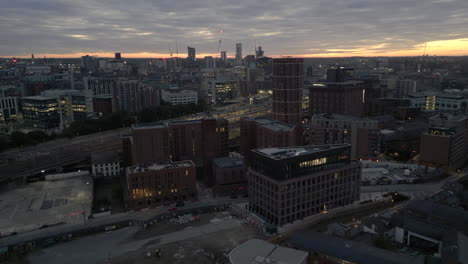 establishing drone shot over outskirts of leeds city centre in low light before sunrise