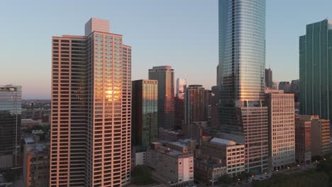 the early morning sun paints the buildings of the chicago skyline