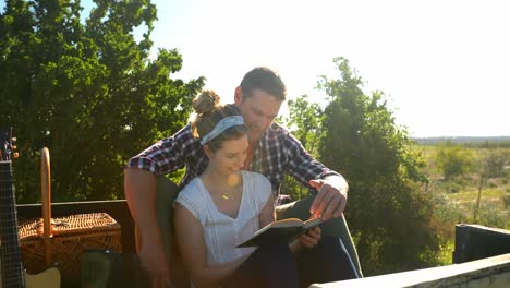 Couple-interacting-with-each-other-while-reading-books-4k