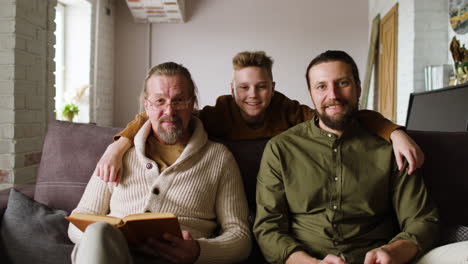 caucasian men sitting on sofa