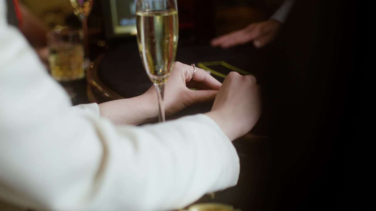 Woman looking at her hand of poker cards.