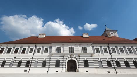 old city building and clear skies with clouds time lapse osijek , croatia