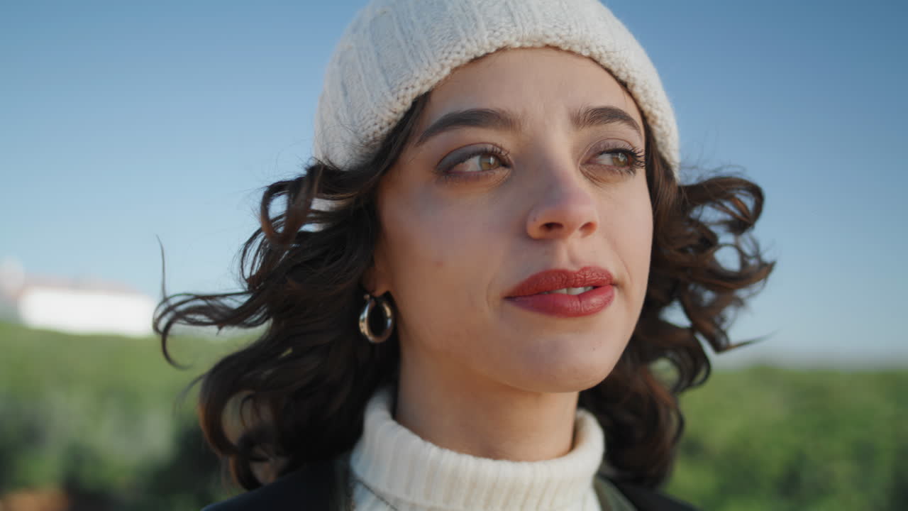 Closeup pretty girl dreaming at cloudless sky. Beautiful romantic woman posing