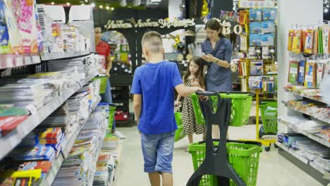 Vinnitsa, Ukraine - August, 2018: Purchase of stationery in the store. Many colorful tools and supplies on the shelf of a stationery shop
