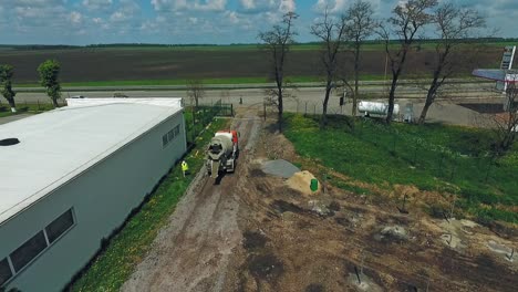 construction site with concrete mixer truck and highway access