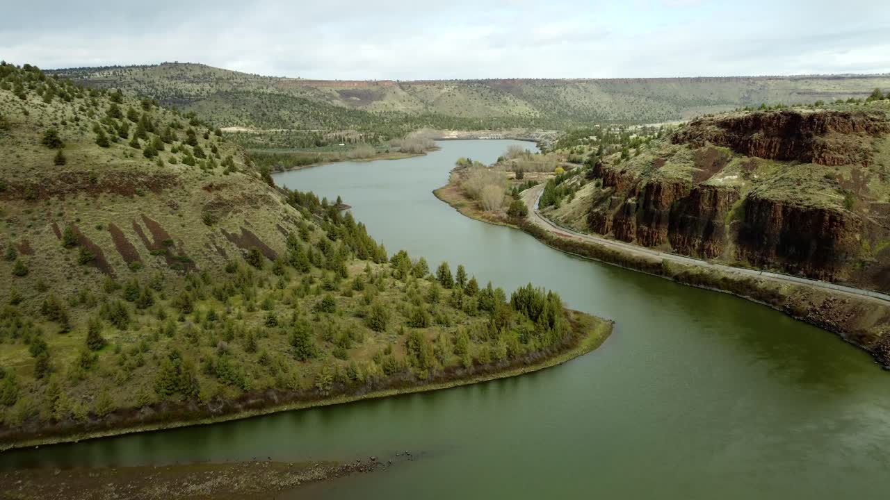 US, Oregon, Warm Springs, Deschutes River, 2025-04-08 - Drone view of the Deschutes River held back behind a dam at the Confederated Tribes of Warm Springs in central Oregon in spring.