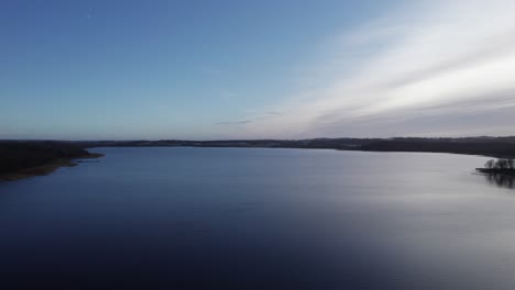 Aerial-Flyover-Beautiful-Scandinavian-Lake-Surrounded-By-Wild-Forest---Dolly-In-Shot