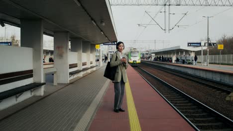 woman waiting at a train station