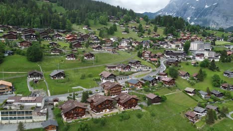 Enchanting-Grindelwald,-Switzerland:-Awe-Inspiring-4K-Drone-Footage-of-Majestic-Swiss-Alps-and-Traditional-Architecture