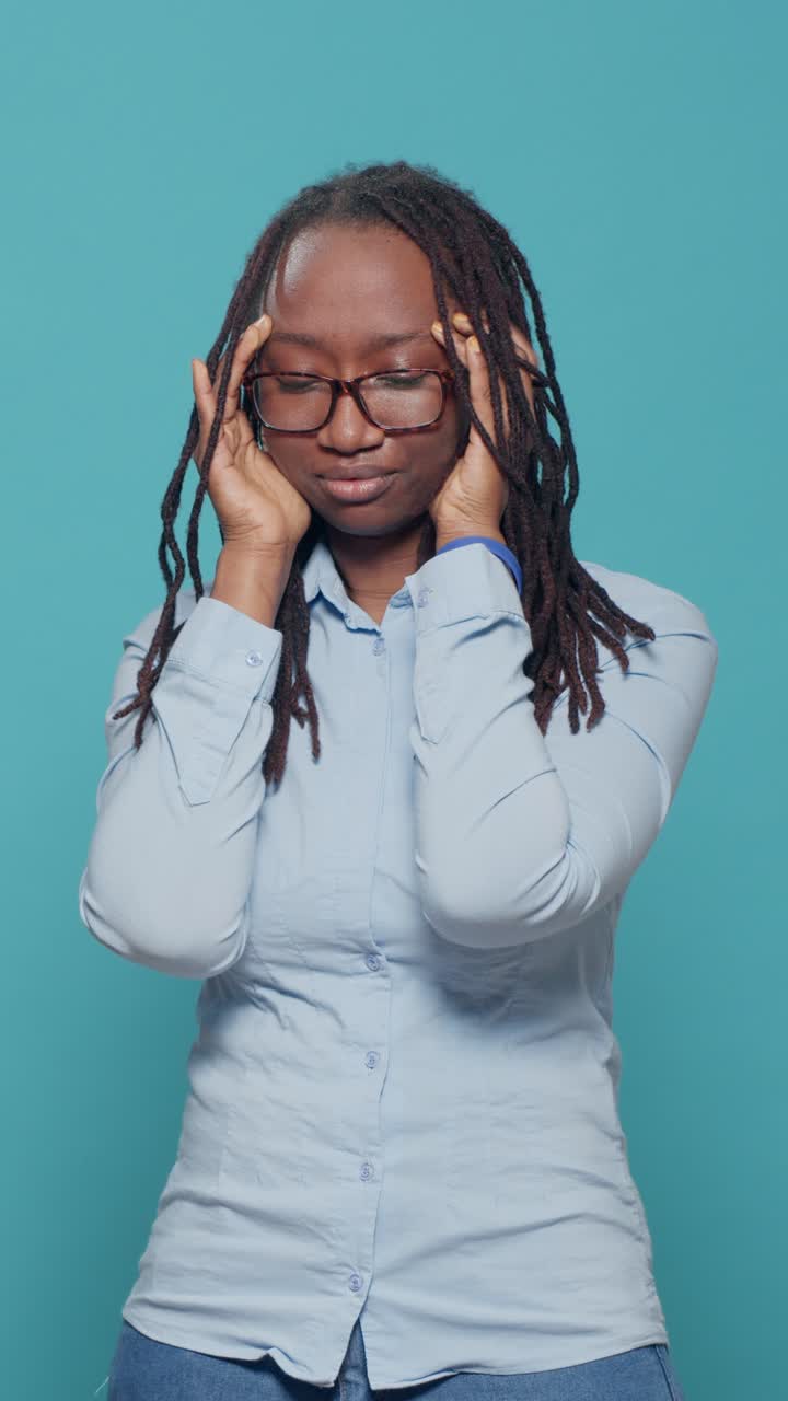 Woman with headache holding her head