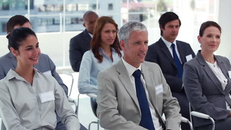 woman in the audience talking