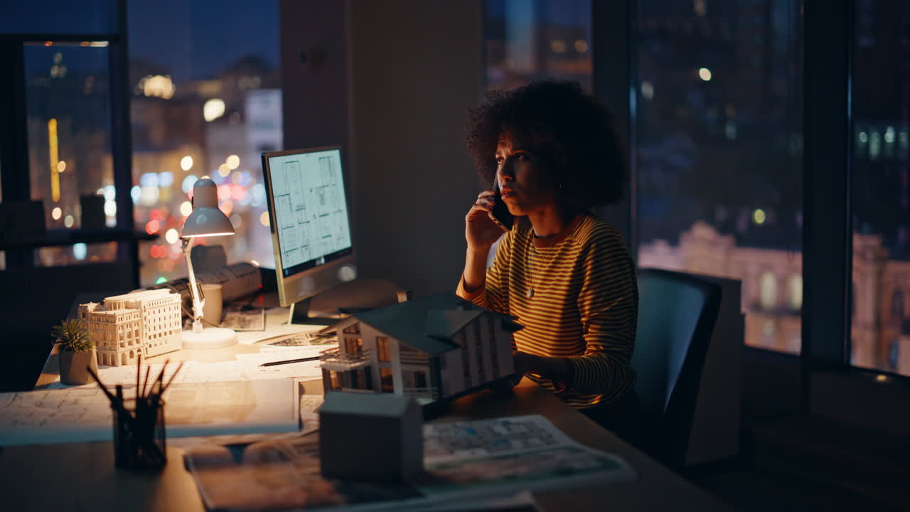 Stressed architect calling night office working on building project overtime