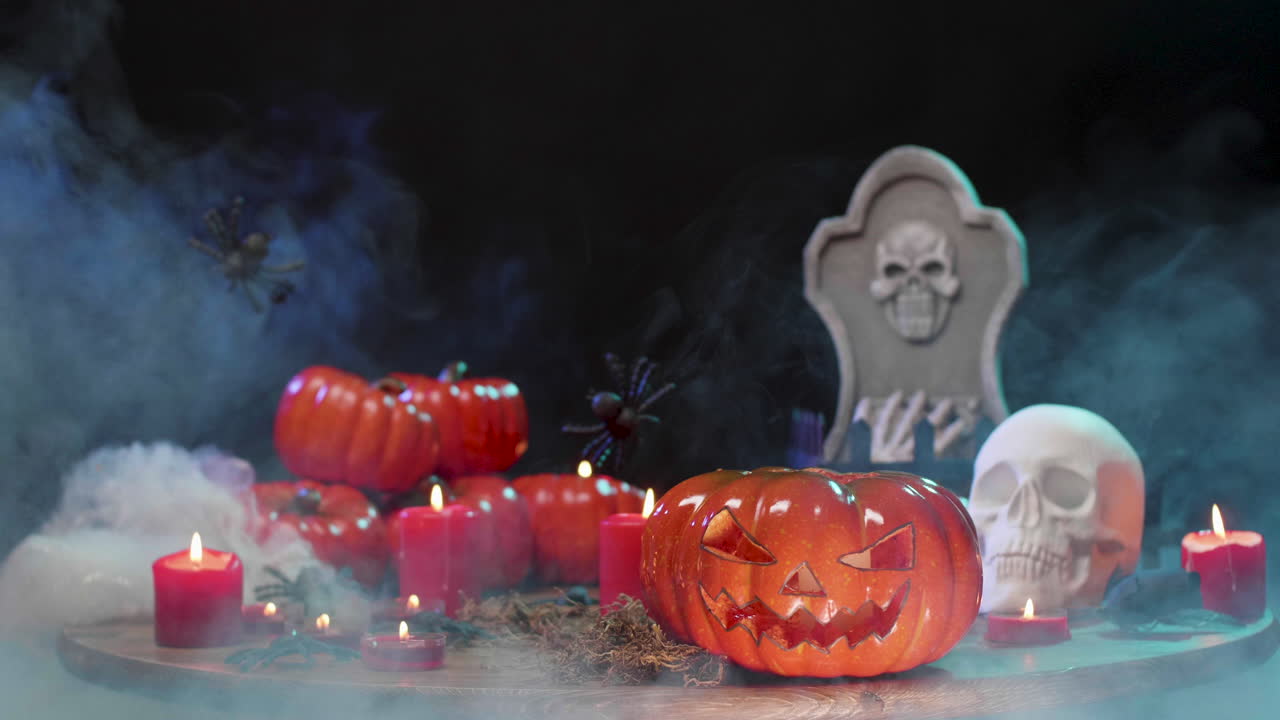 Halloween Scene with Pumpkins, Candles, Skull, and Tombstone