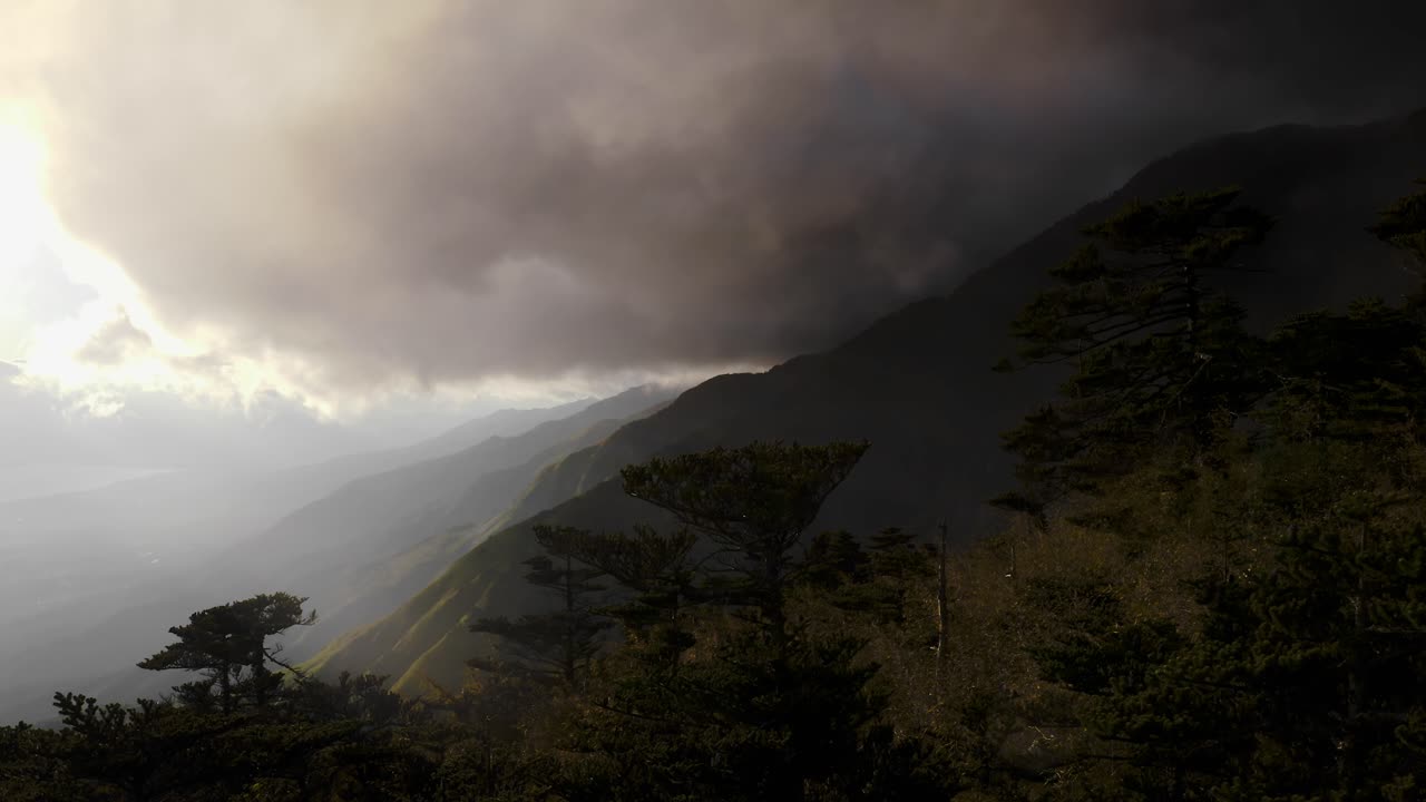 Stormy cloudscape over Mount Cangshan mountainside in Yunnan China, aerial view