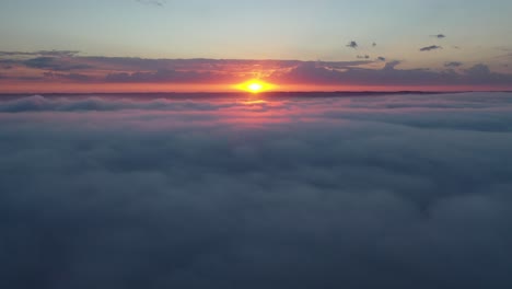 sunrise or sunset over a sea of clouds