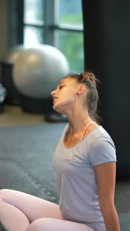 woman stretching in gym