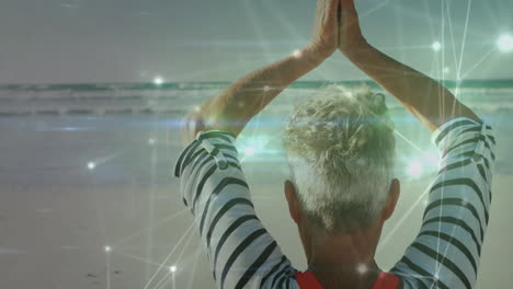practicing yoga on beach, person surrounded by glowing animation effects