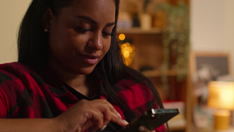 woman using smartphone indoors