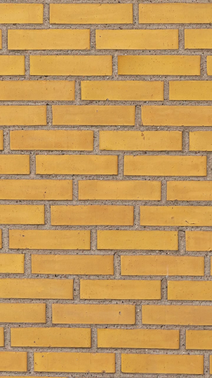 Yellow brick wall surface pattern