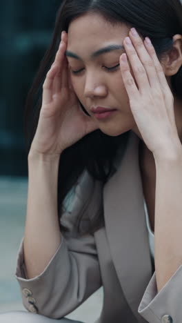 woman experiencing stress and headache