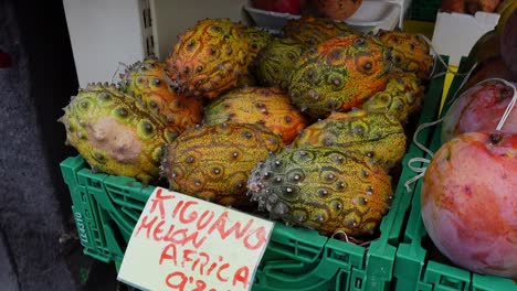 african exotic fruit kiguano kiwano horned melon cucumber with spikes at spanish fruit market display