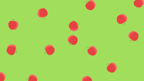 animation of multiple red apples rotating and falling on green background