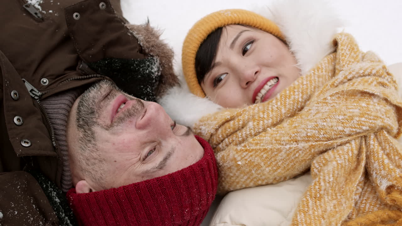 Couple Lying in the Snow