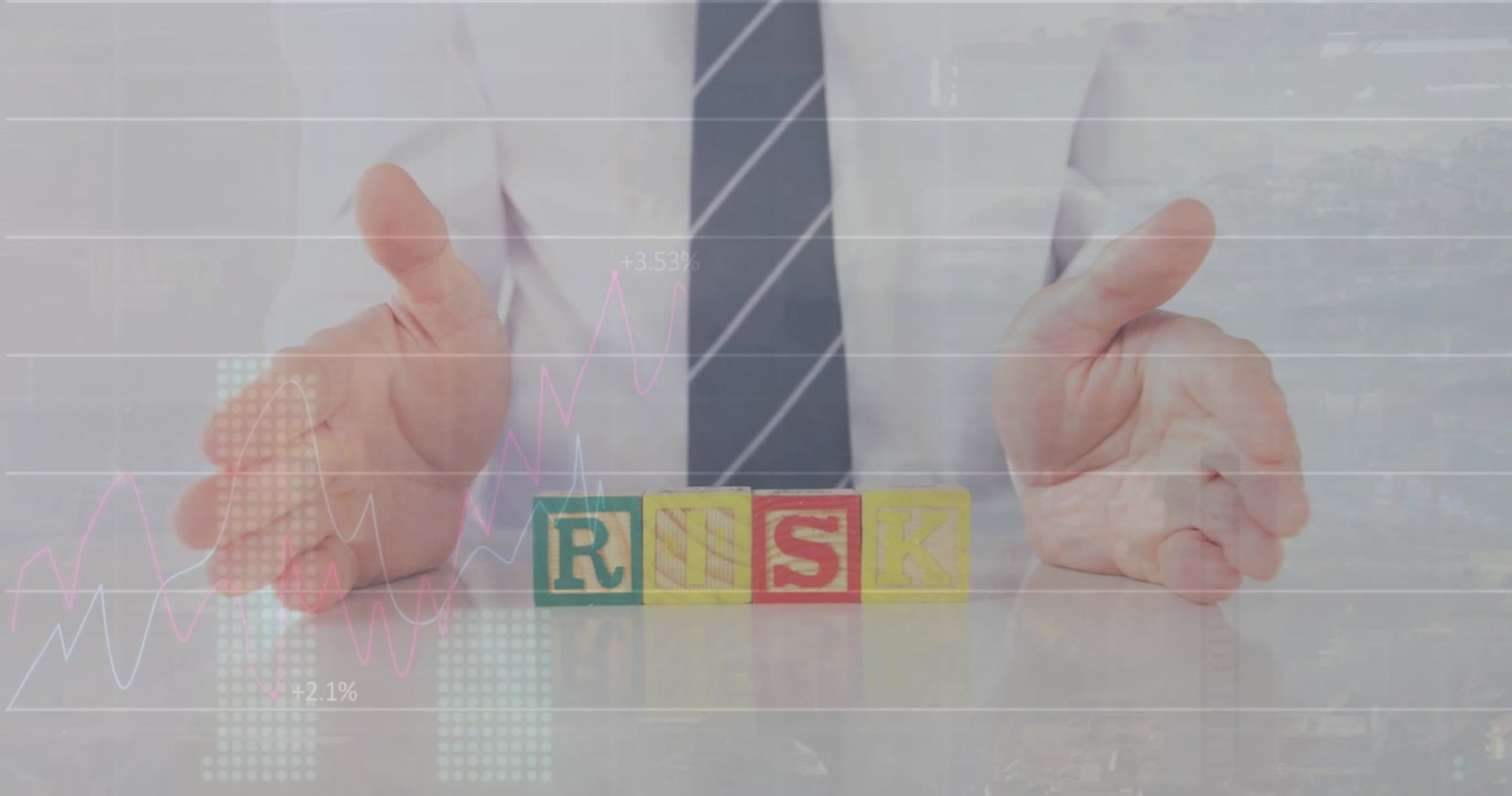 Animation of graphs and numbers, midsection of caucasian businessman with risk text on wooden blocks