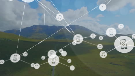 Animación-De-íconos-Conectados-Sobre-Un-Paisaje-Verde-Contra-Montañas-Y-Cielo-Nublado