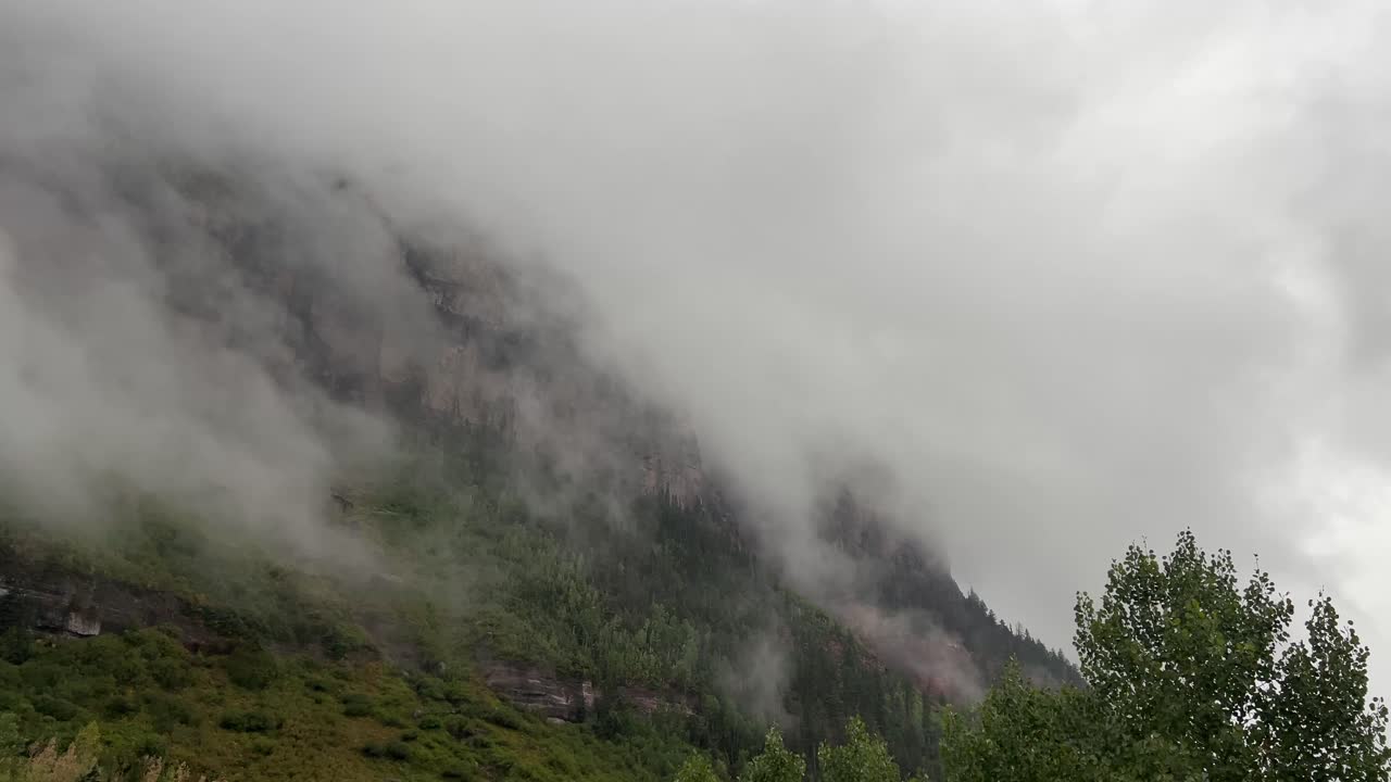 Countryside alpine region, nature outdoor retreat riany covered in morning mist fog