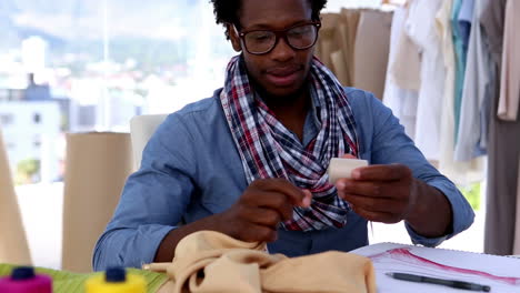 fashion designer working with a fabric